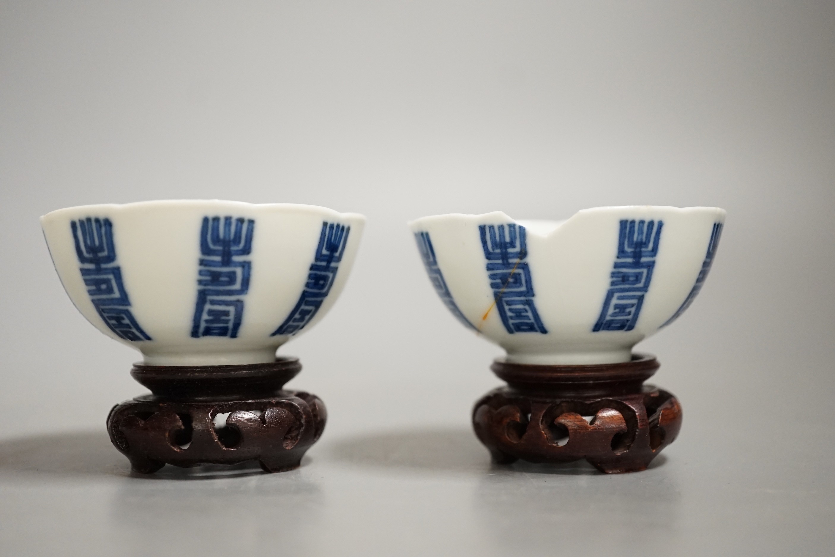 A pair of Chinese blue and white 'shou' cups, 19th century.